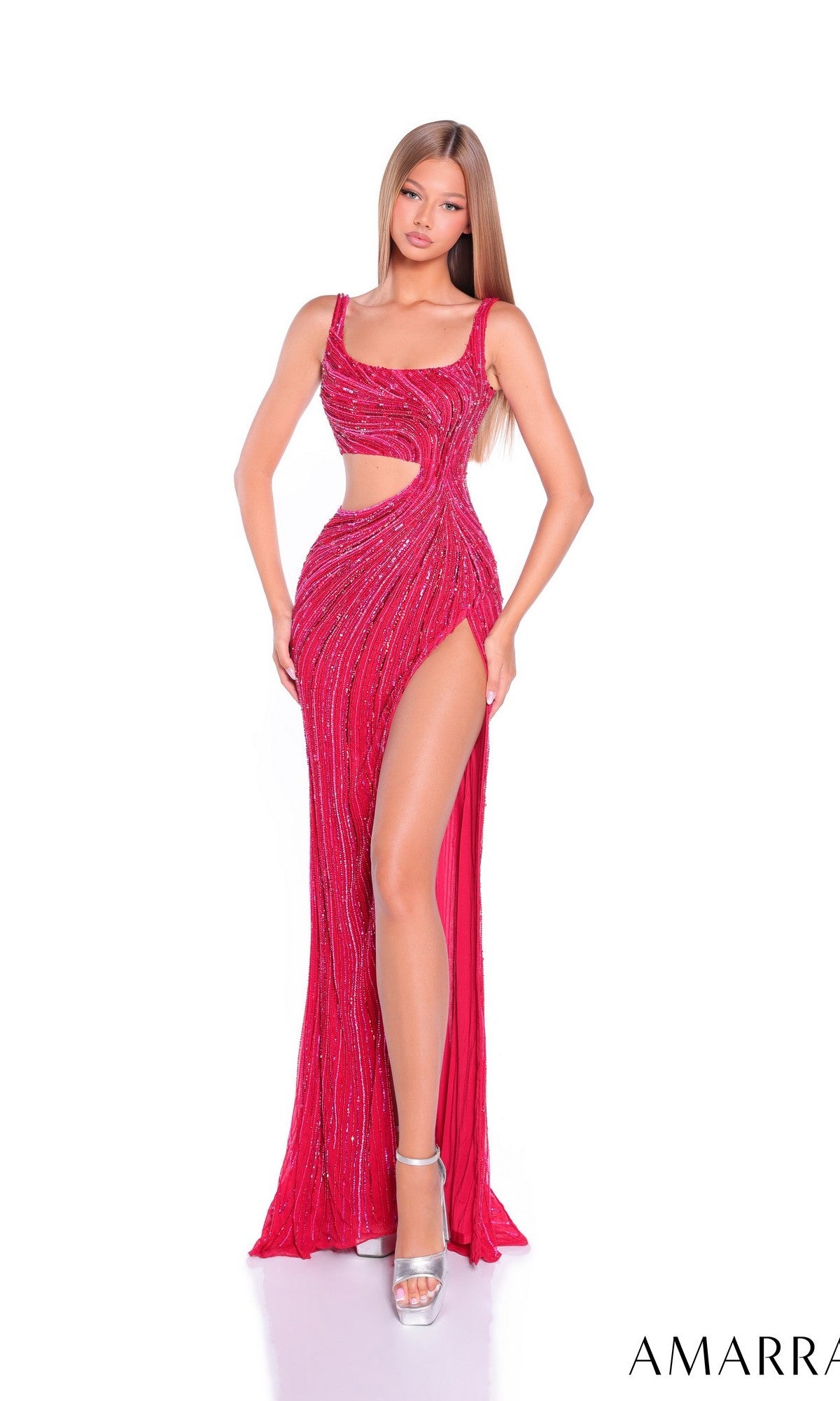 A woman wears the Long Prom Dress: Amarra 89061, a fitted red sequin gown with a sleeveless design, thigh-high slit, and side cutout. She finishes her sparkling look with silver high heels.